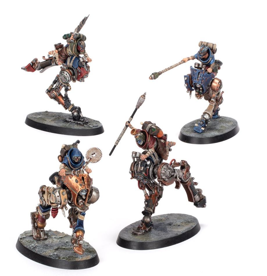 Four metallic fantasy warrior figurines on a white background