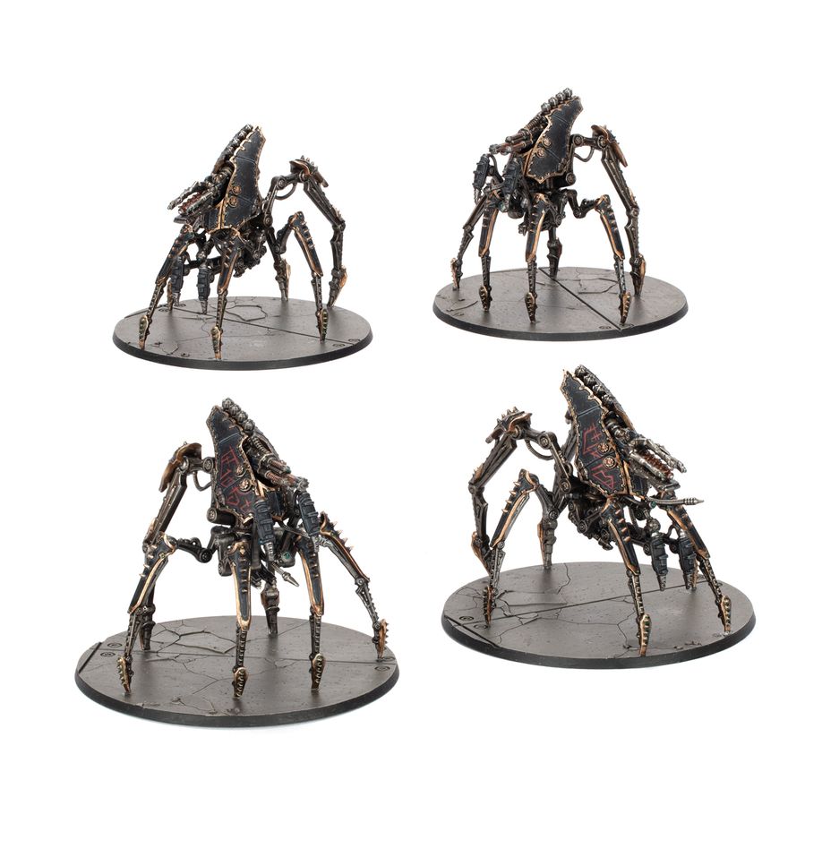 Four metallic spider-like warhammer figurines on stands against a white background