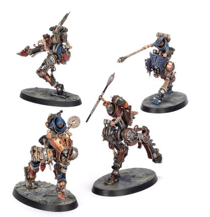 Four metallic fantasy warrior figurines on a white background